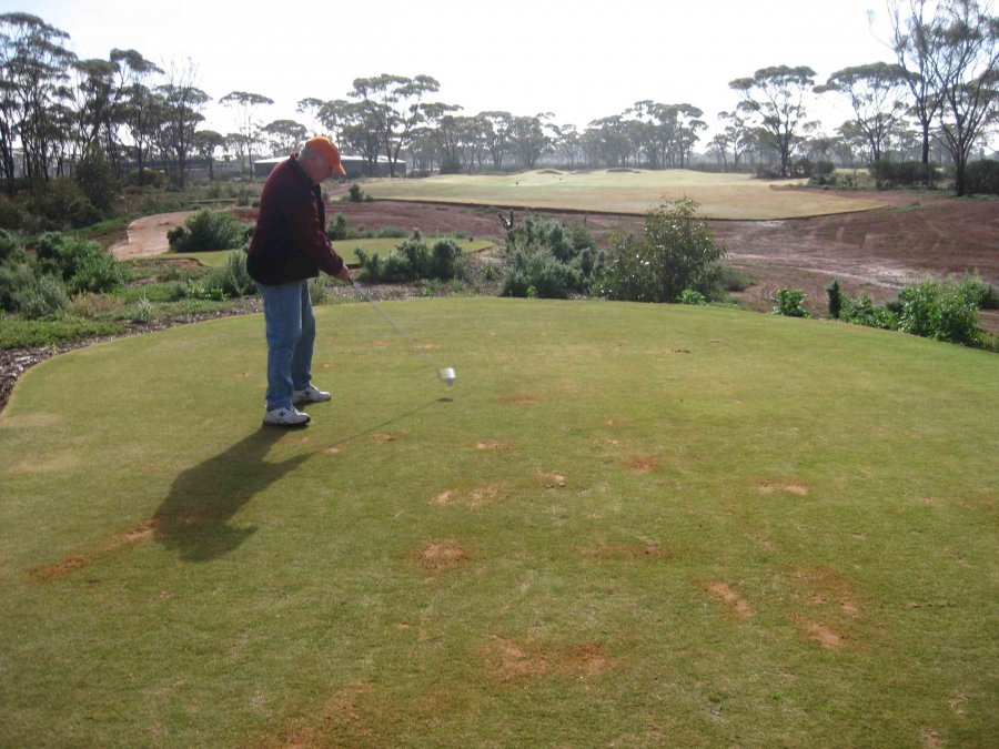 Michael hitting off on the Golden Mile hole at Kalgoorlie Golf Course