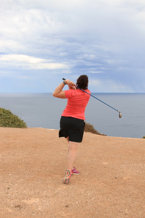 Raelee hitting over the water hazard